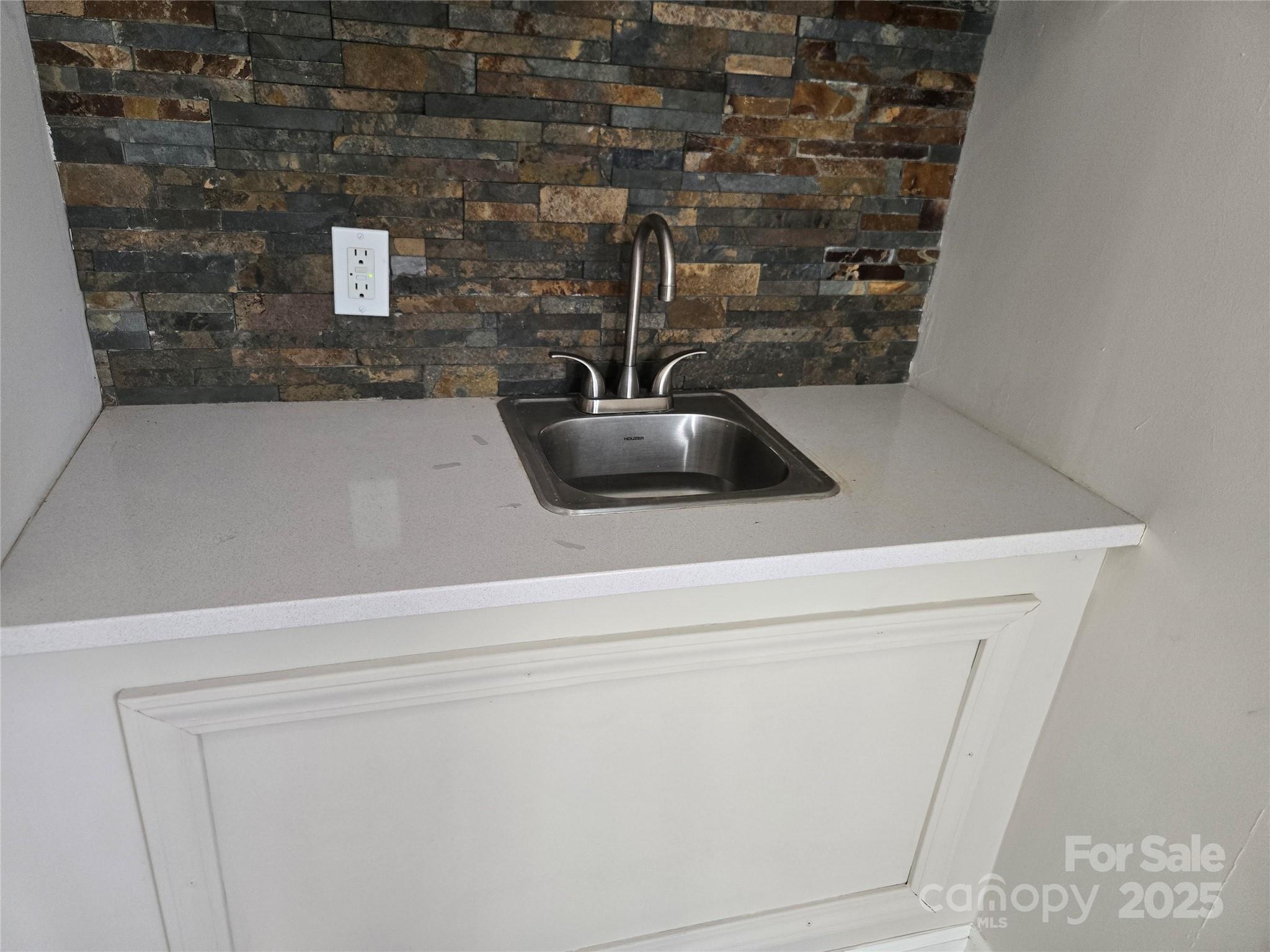 7214 Fox Hunt Road Charlotte, NC 28212 - Photo 22 of 24 a close view of sink and tap