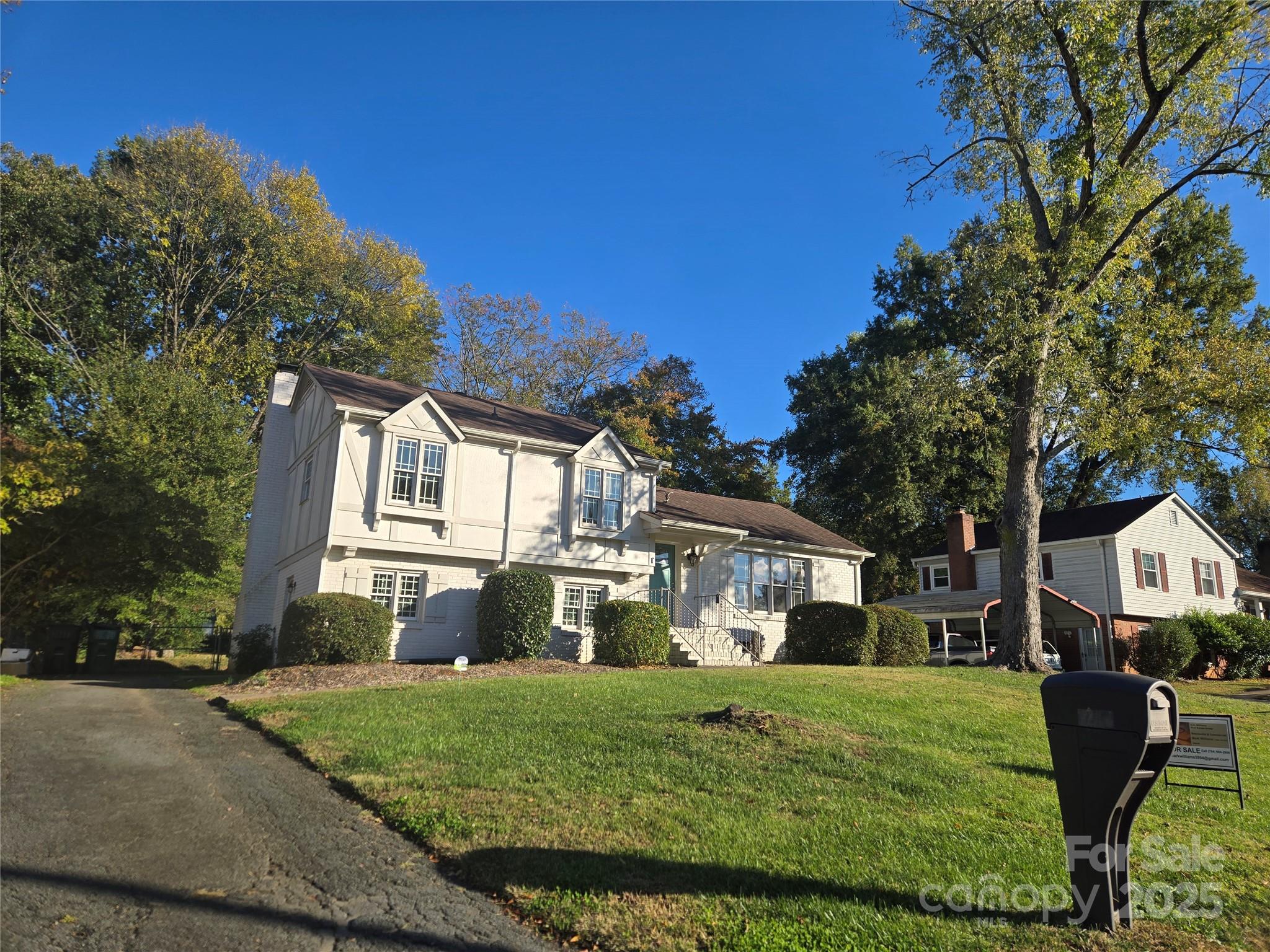 7214 Fox Hunt Road Charlotte, NC 28212 - Photo 23 of 24 a front view of a house with a yard
