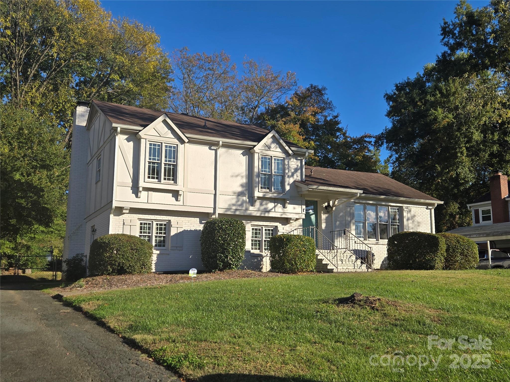 7214 Fox Hunt Road Charlotte, NC 28212 - Photo 24 of 24 a front view of a house with a yard and trees