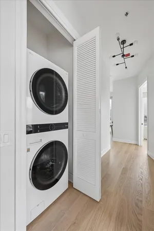 a view of a hallway with washer and dryer