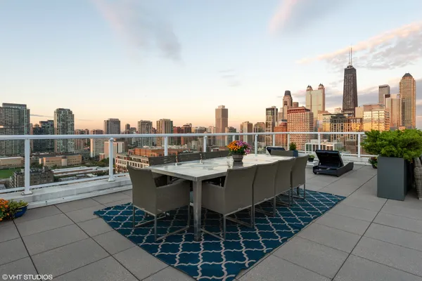 a view of a terrace with outdoor seating