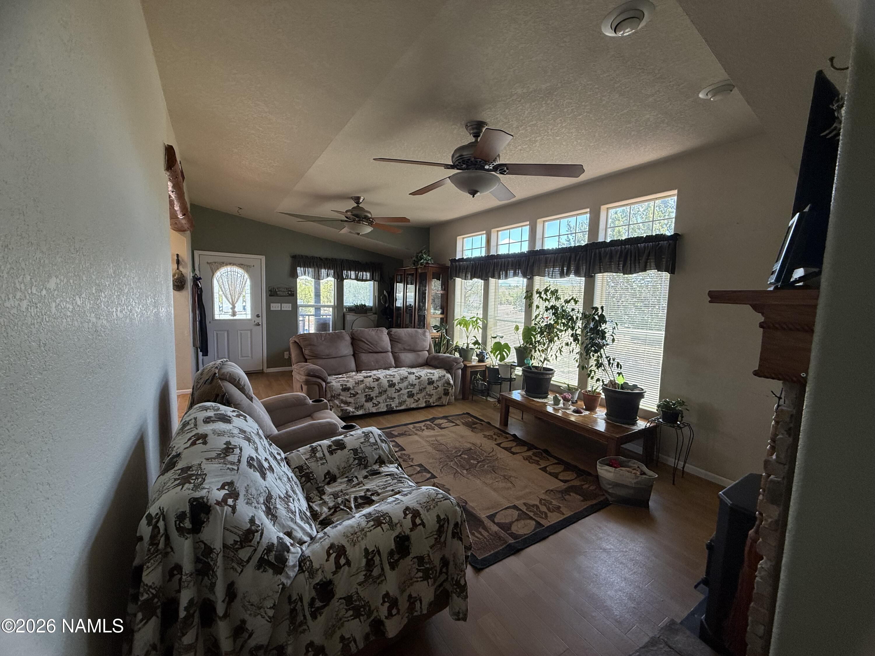 1431 East Cedar Road Williams, AZ 86046 - Photo 22 of 51 a living room with furniture and a large window