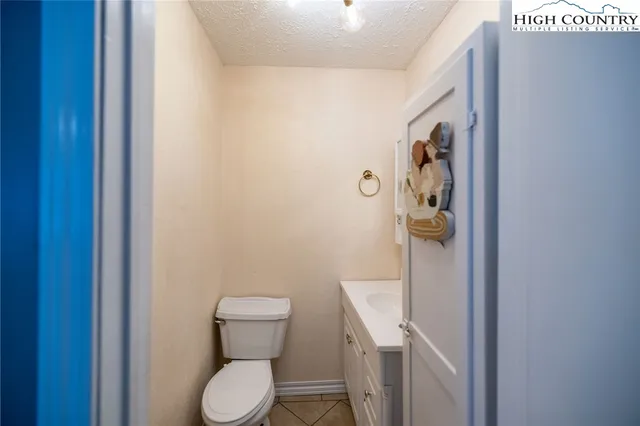 a white toilet sitting next to a bathroom sink