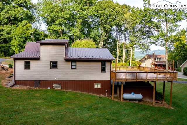 a view of a field with a tree