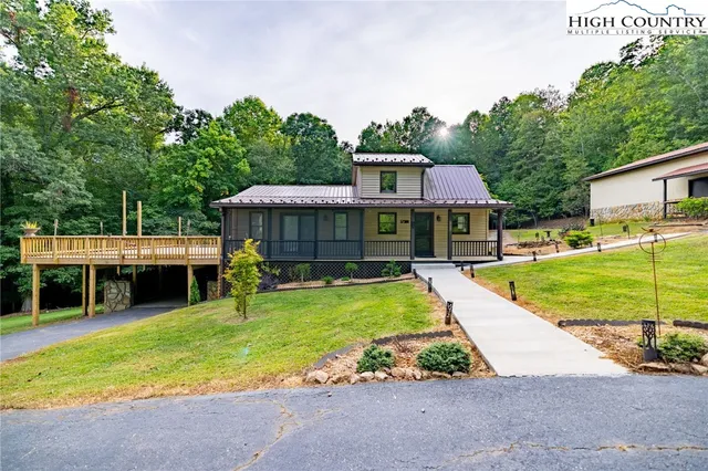 a view of a backyard with plants and a patio