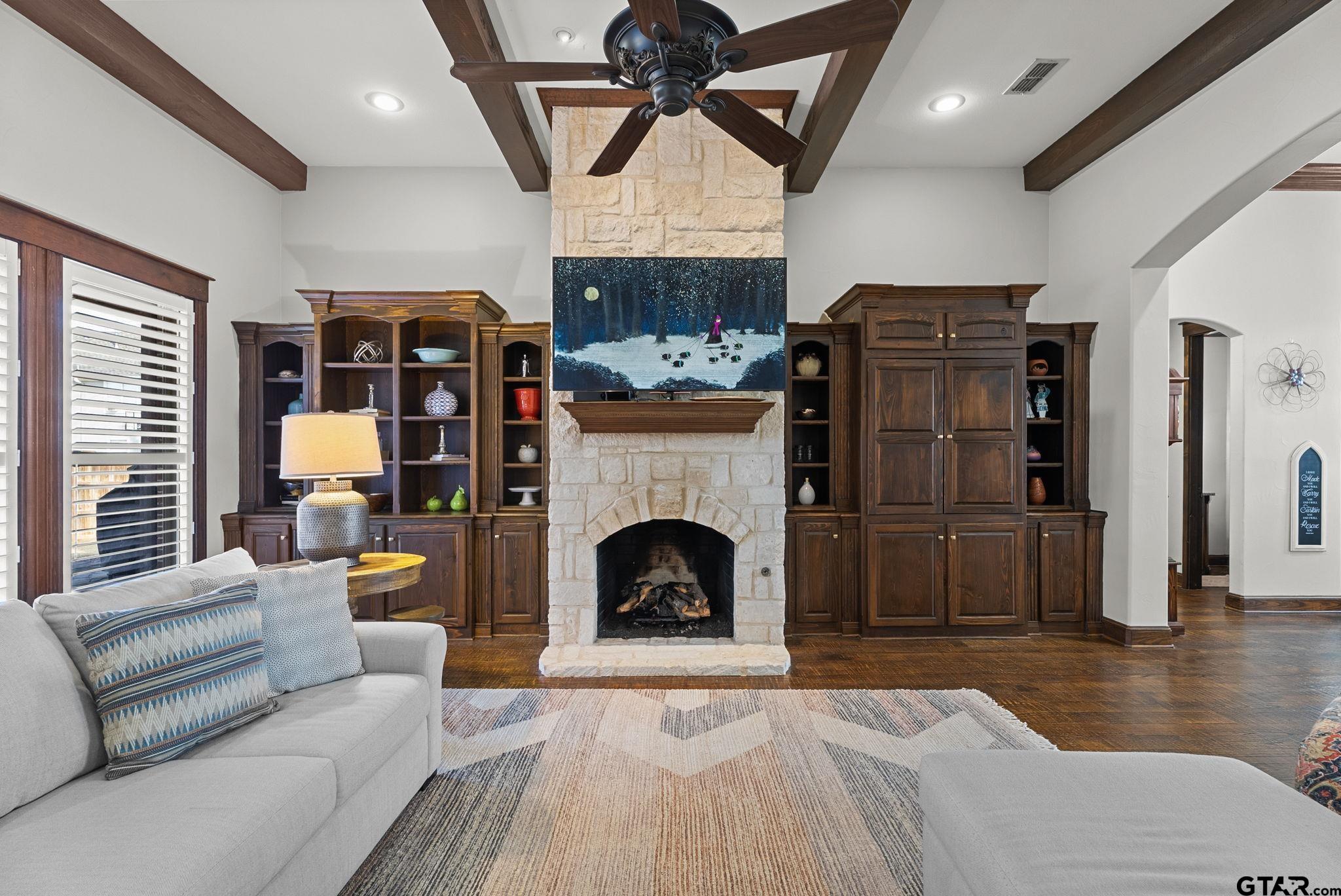 2306 Kingsmill Circle Tyler, TX 75703 - Photo 19 of 37 a living room with furniture and a fireplace