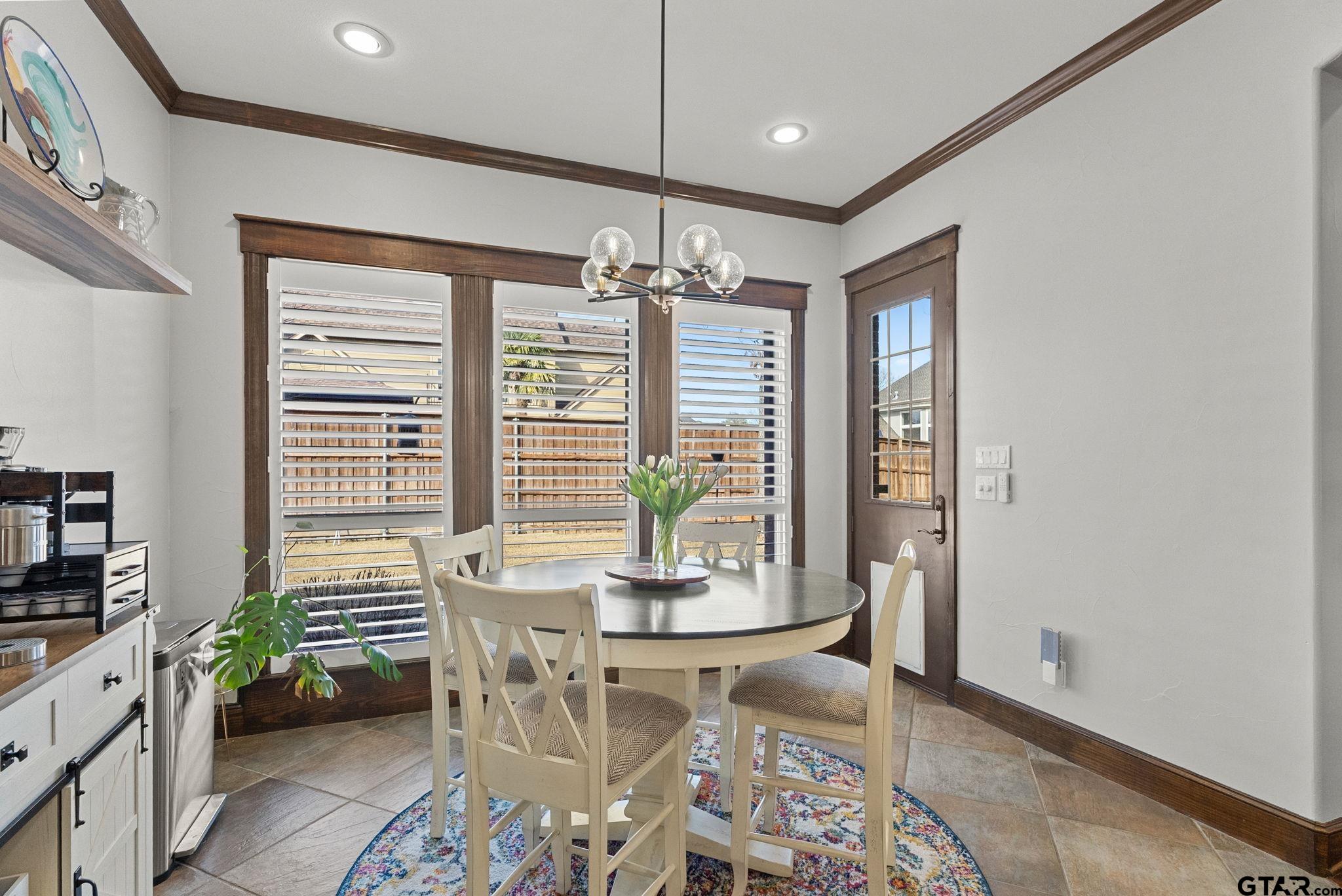 2306 Kingsmill Circle Tyler, TX 75703 - Photo 21 of 37 a dining room with furniture and window