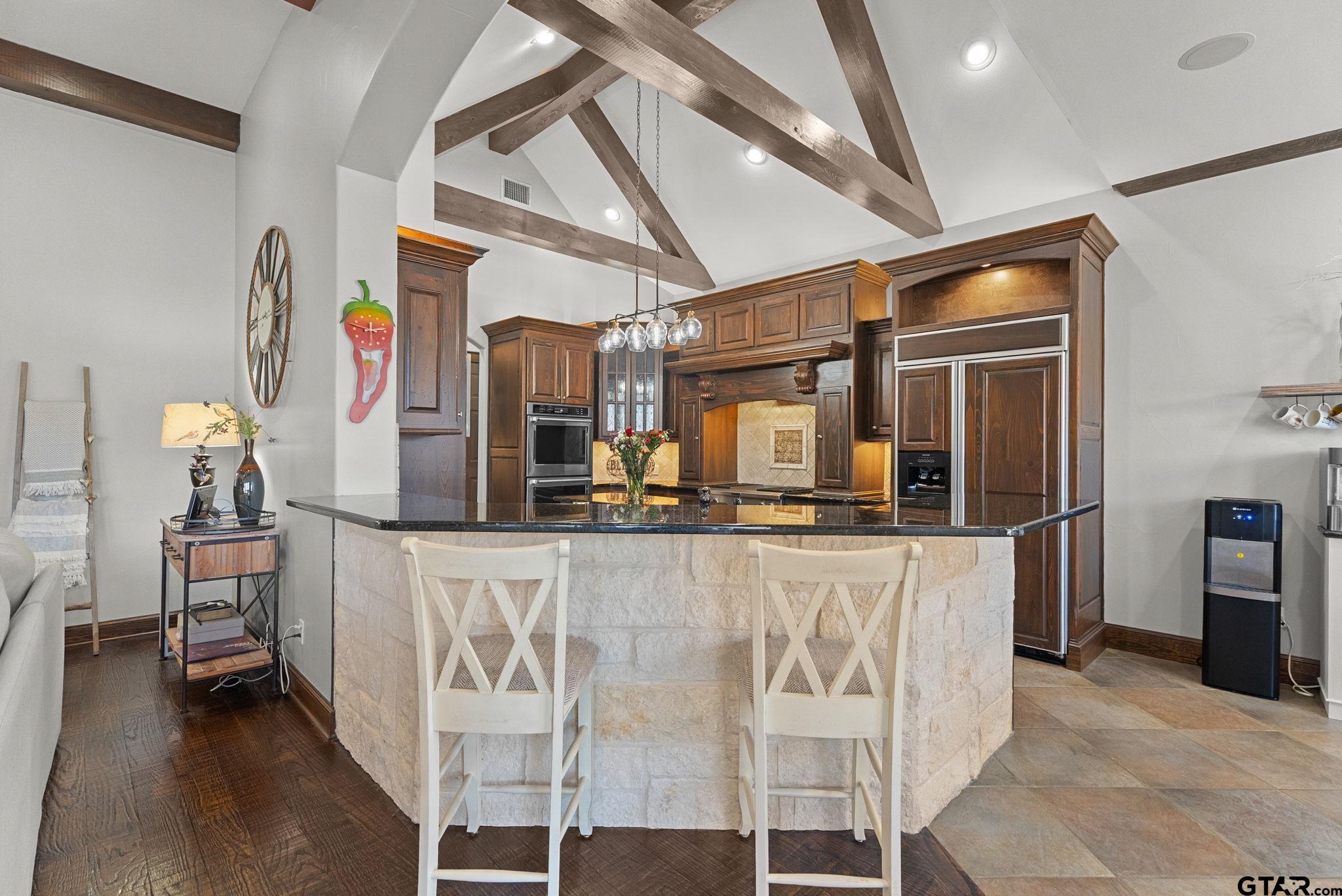2306 Kingsmill Circle Tyler, TX 75703 - Photo 23 of 37 a kitchen with stainless steel appliances granite countertop a sink and cabinets