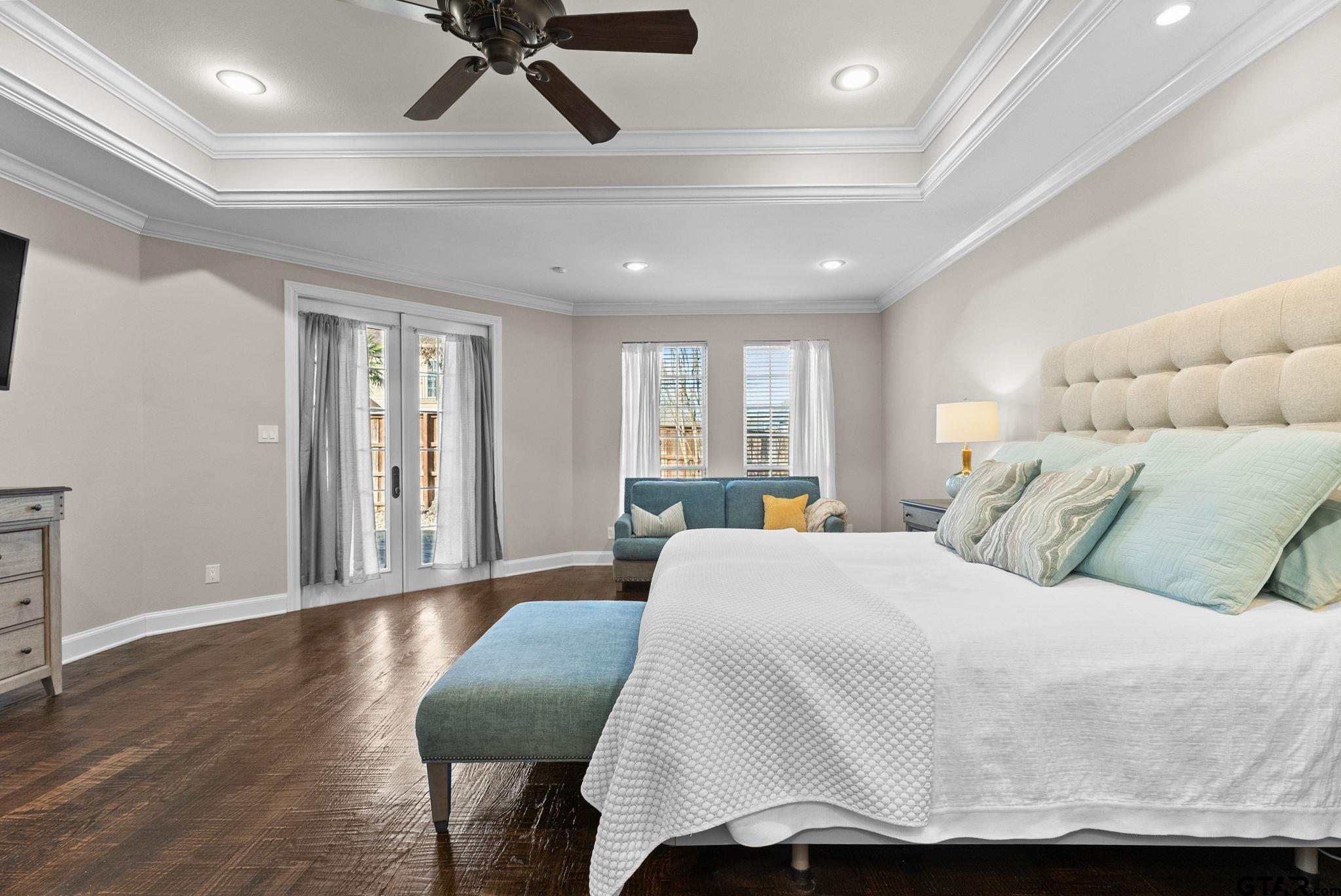 2306 Kingsmill Circle Tyler, TX 75703 - Photo 4 of 37 a bedroom with a bed and wooden floor