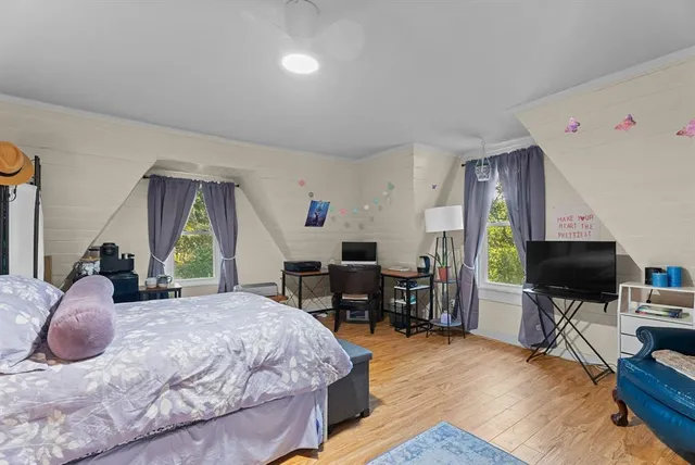 a bedroom with a bed and furniture