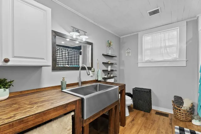 a utility room with dryer washer and a view of living area