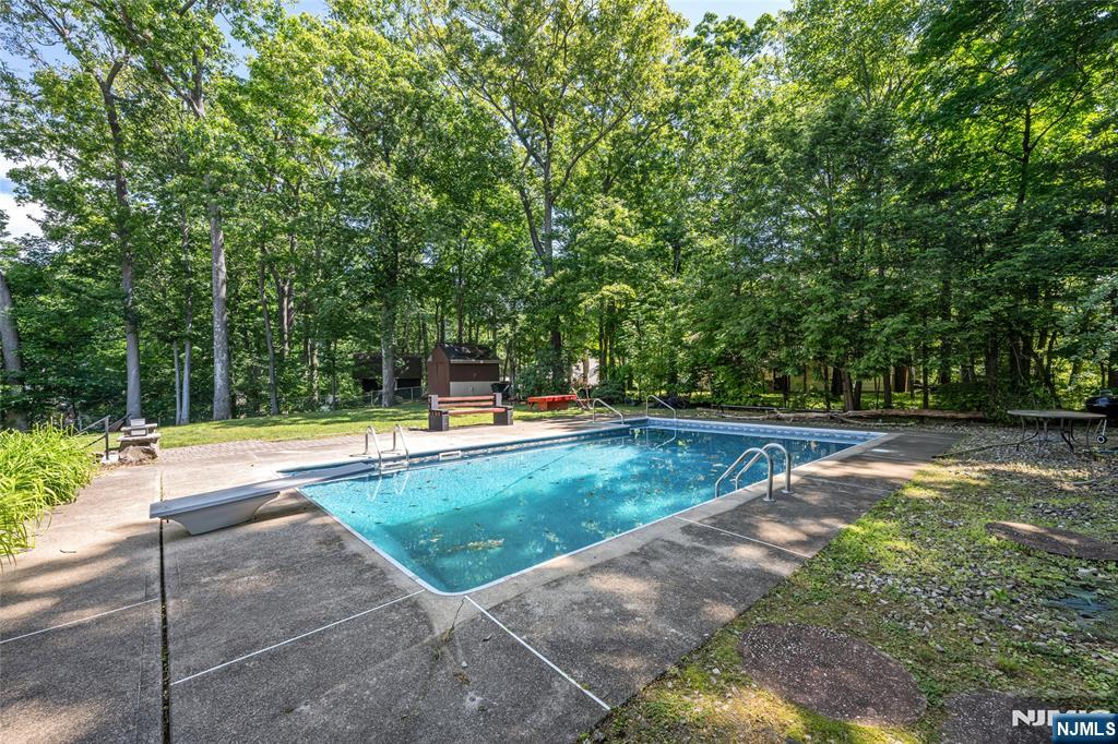 21 Marcia Road Ringwood, NJ 07456 - Photo 36 of 42 a view of a swimming pool with a yard