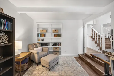 a view of a livingroom with workspace and a couch
