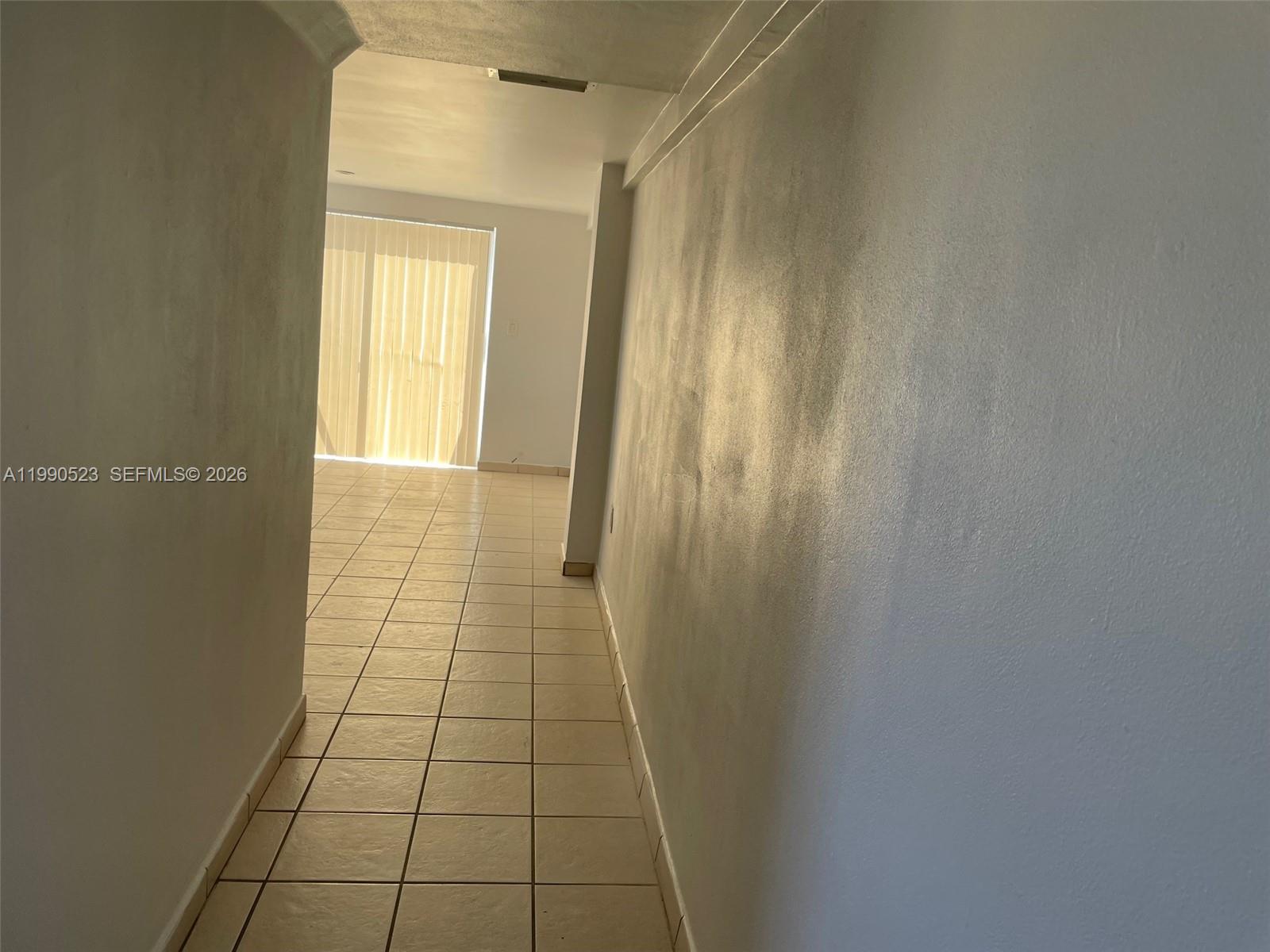 1787 Southwest 7th Street, Unit 7 Miami, FL 33135 - Photo 3 of 9 a view of empty room with windows