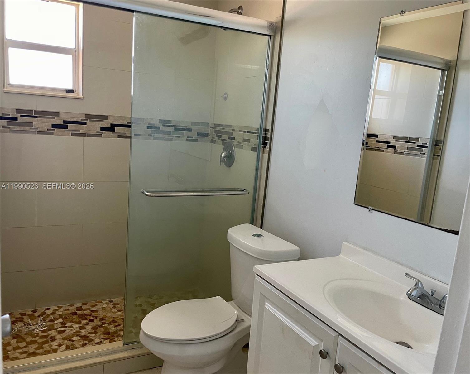 1787 Southwest 7th Street, Unit 7 Miami, FL 33135 - Photo 9 of 9 a bathroom with a sink a toilet and shower