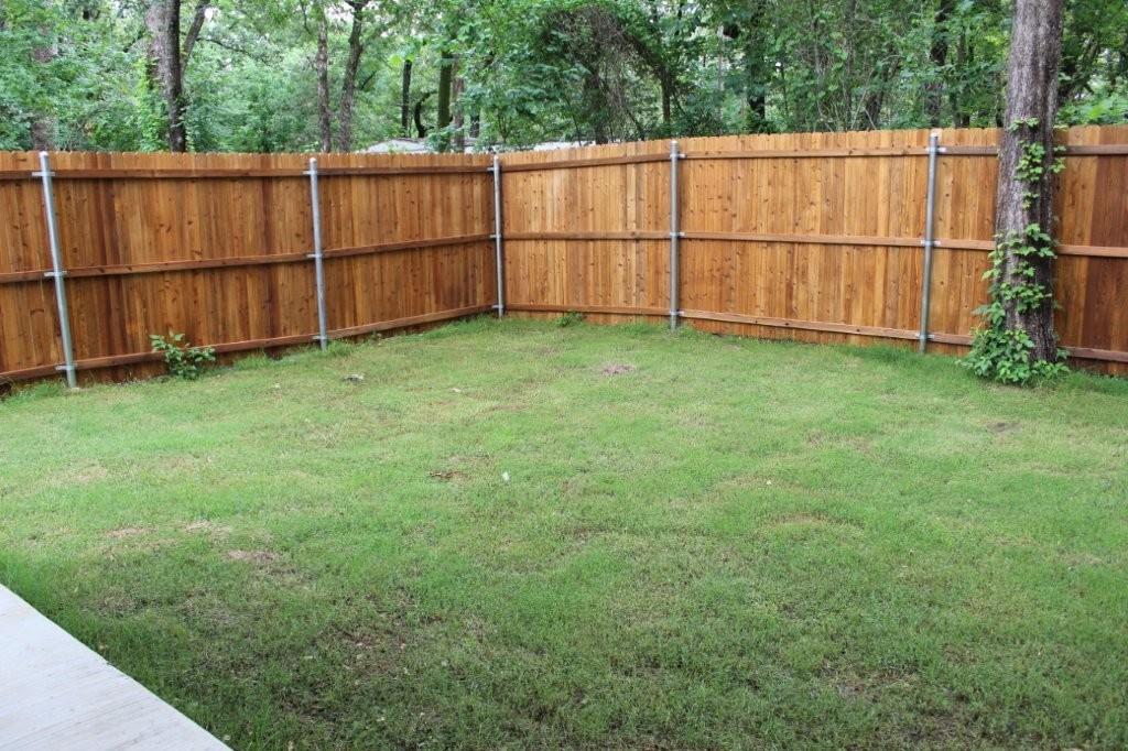 125 Chapperall Drive Mabank, TX 75156 - Photo 5 of 11 a view of a backyard with wooden fence