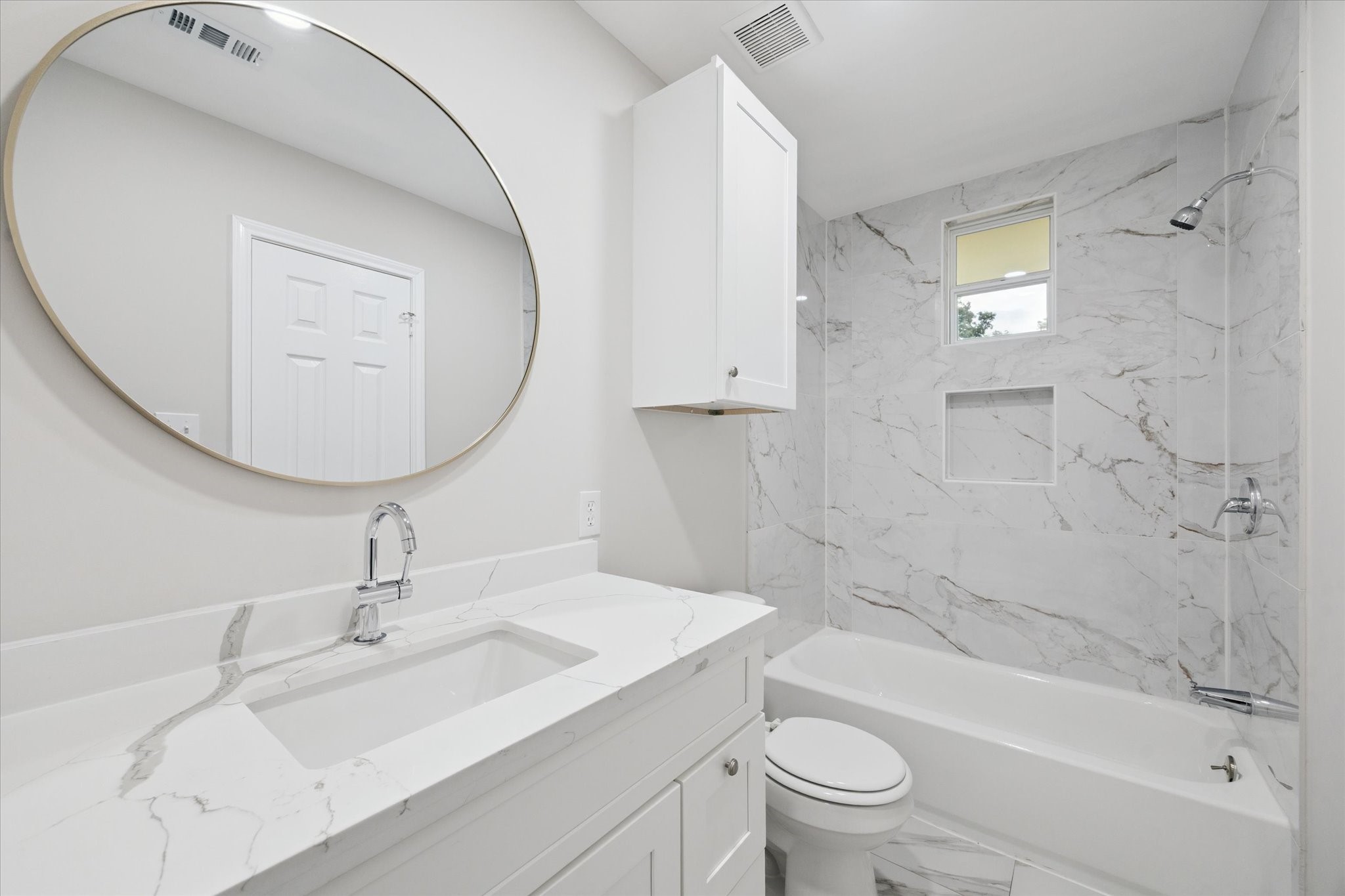10009 Lazy Oaks Street Houston, TX 77080 - Photo 19 of 23 a bathroom with a sink a toilet and shower