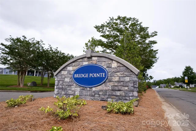 a sign that is on a brick wall