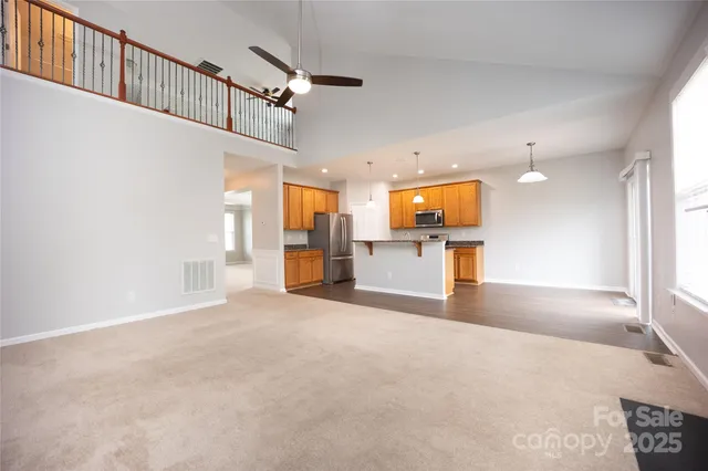 a view of a kitchen with a sink and a window