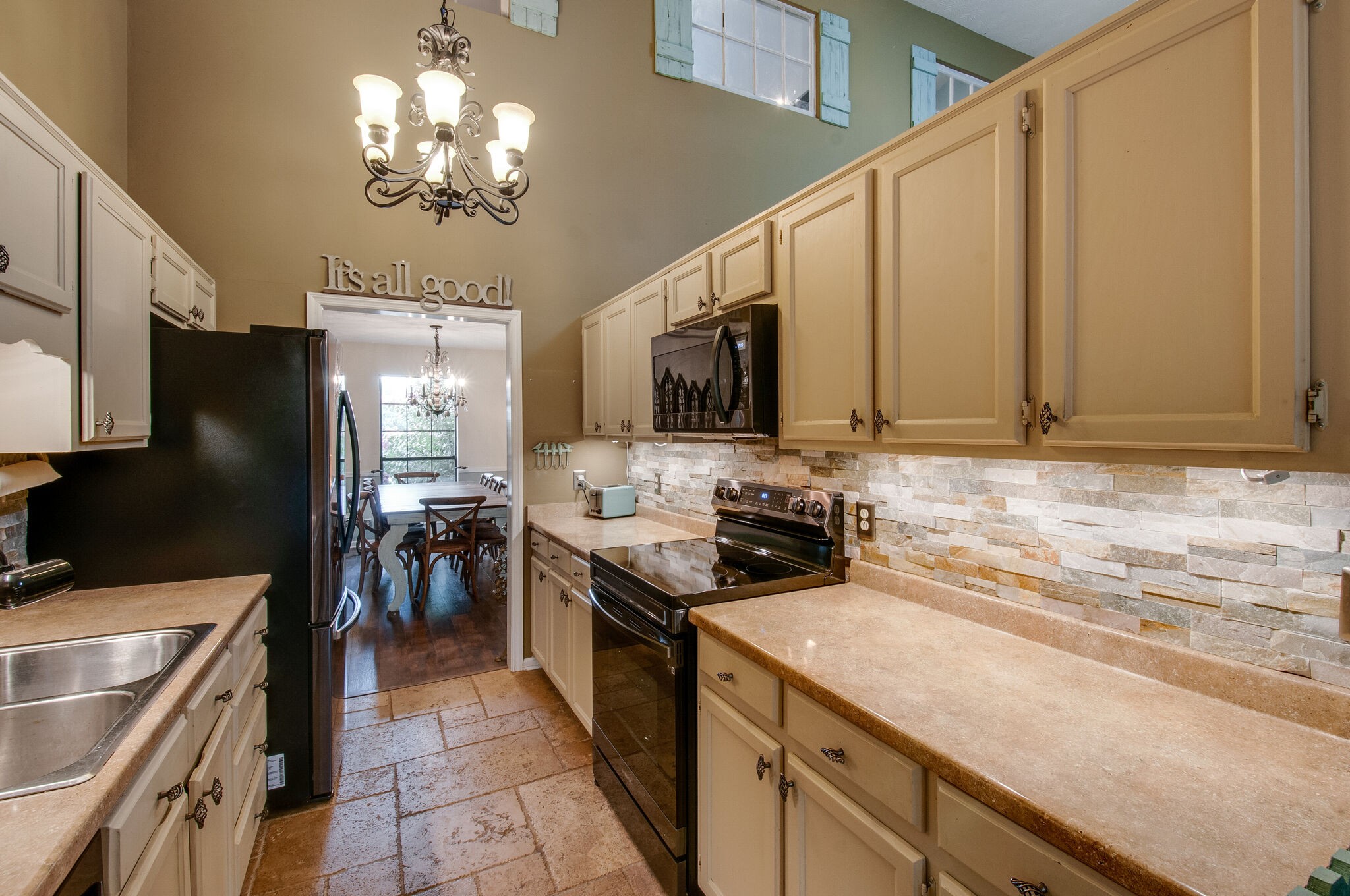 904 Fallview Trail Nashville, TN 37211 - Photo 15 of 38 a kitchen with stainless steel appliances a stove sink microwave and cabinets