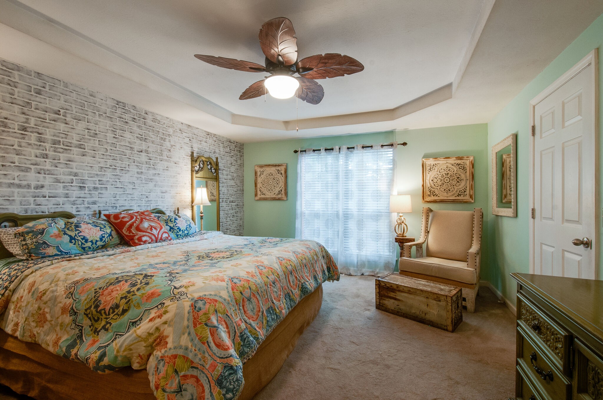 904 Fallview Trail Nashville, TN 37211 - Photo 18 of 38 a bedroom with a bed a couch and a chandelier