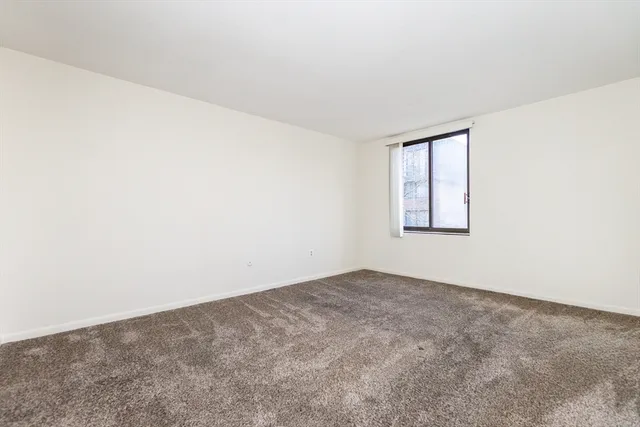 a bathroom with a toilet sink and vanity