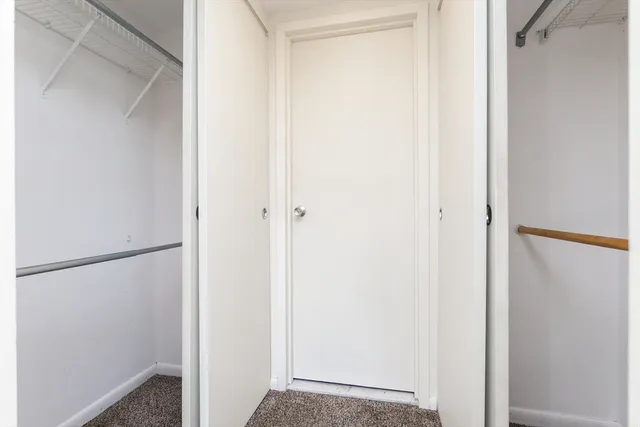 a view of a bathroom from a corridor