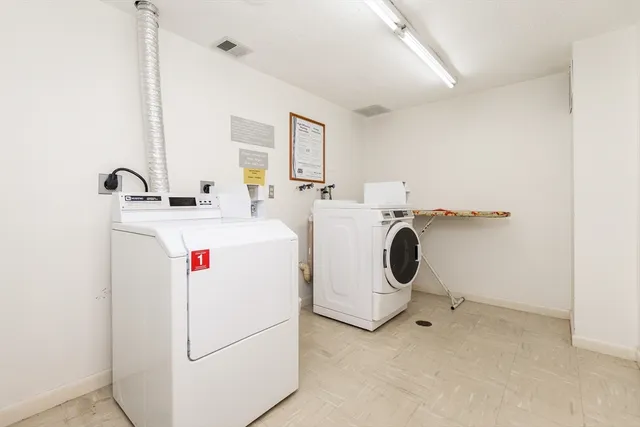 a front view of a building with sitting area