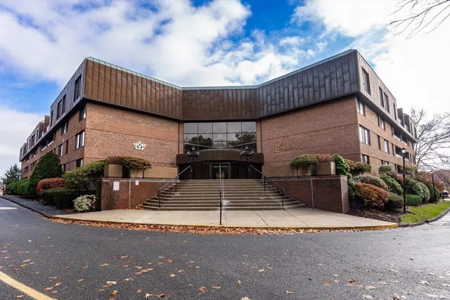 a view of a building with a street