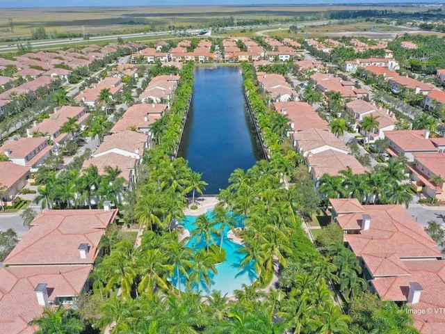 an aerial view of a house with a garden and plants