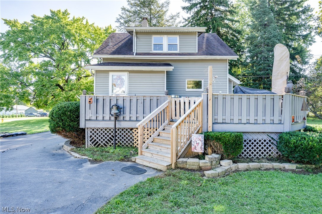 5840 Poland Struthers Road Youngstown, OH 44514 - Photo 9 of 50 Exterior featuring horizontal siding, a multi-level wood deck, and a wood staircase with railings