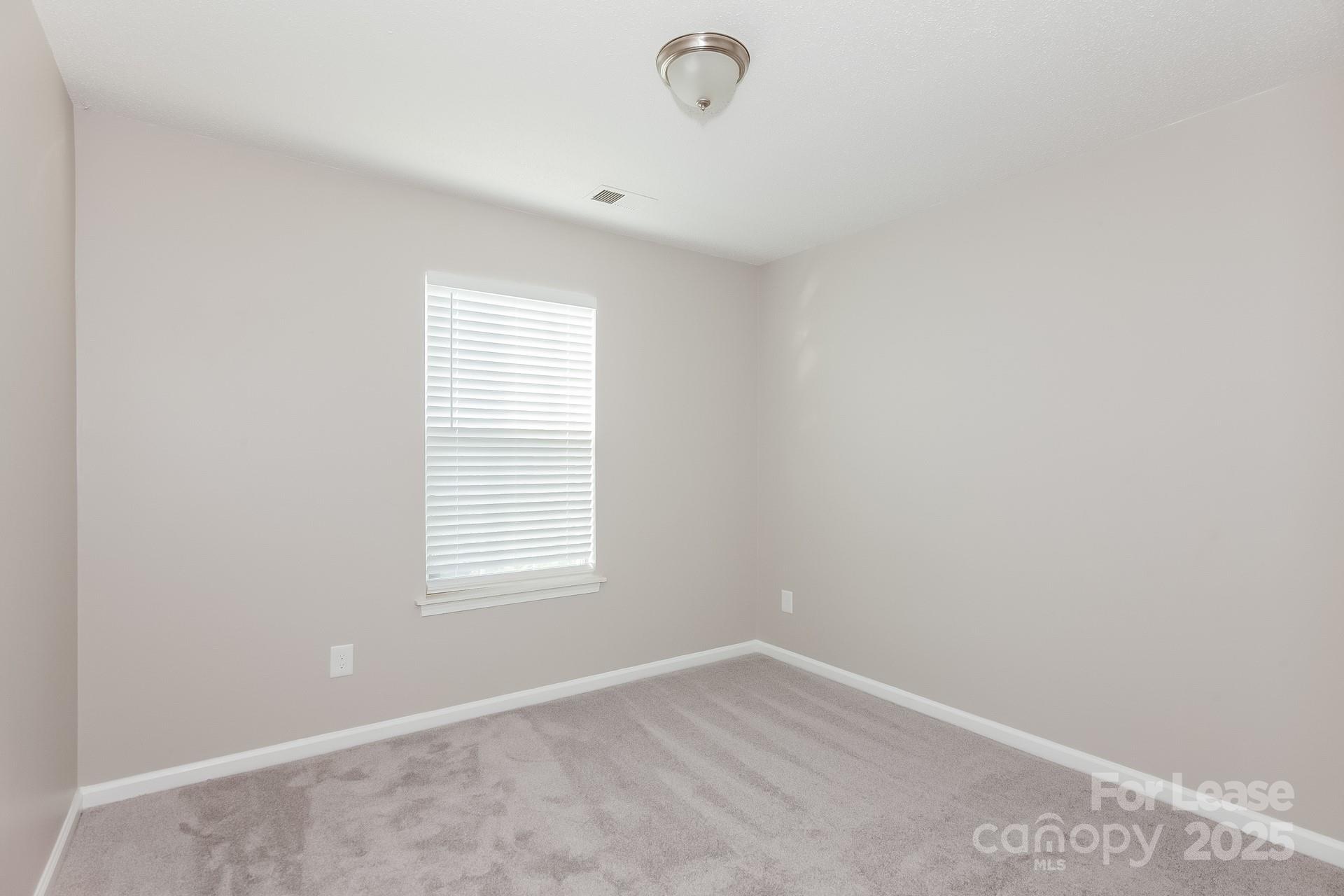 5537 Lemley Road Northwest Concord, NC 28027 - Photo 11 of 17 a view of an empty room with a window