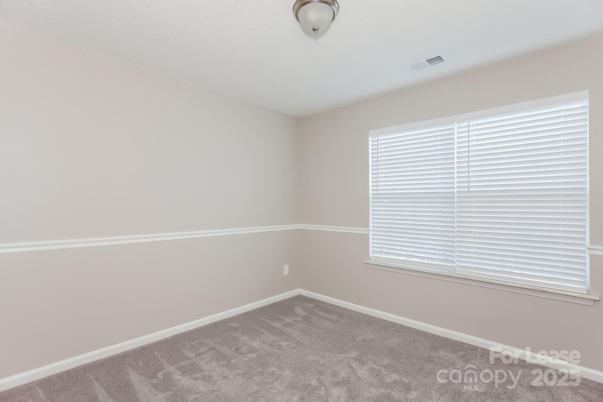 5537 Lemley Road Northwest Concord, NC 28027 - Photo 12 of 17 a view of an empty room with a window