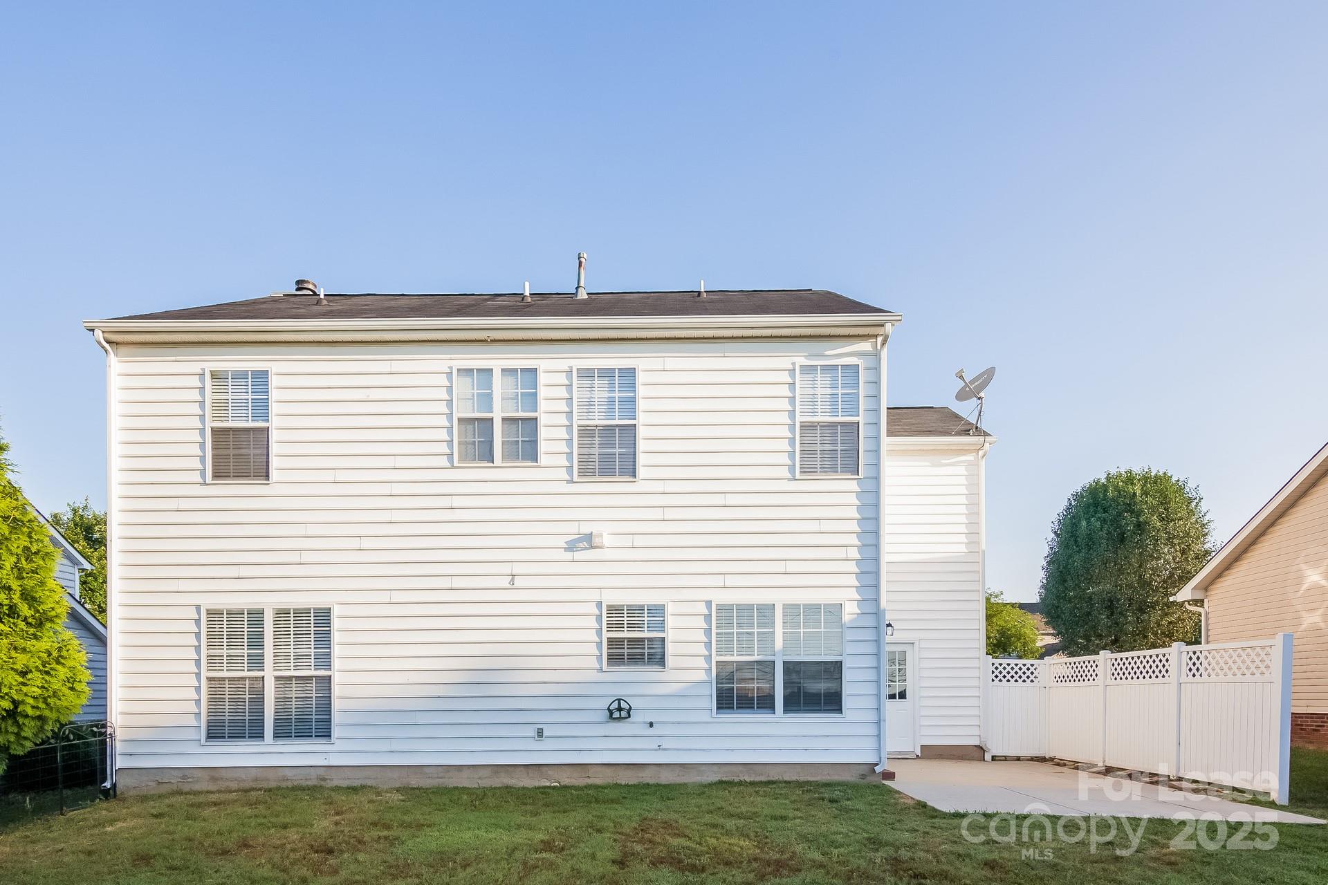 5537 Lemley Road Northwest Concord, NC 28027 - Photo 15 of 17 a view of a house with a backyard