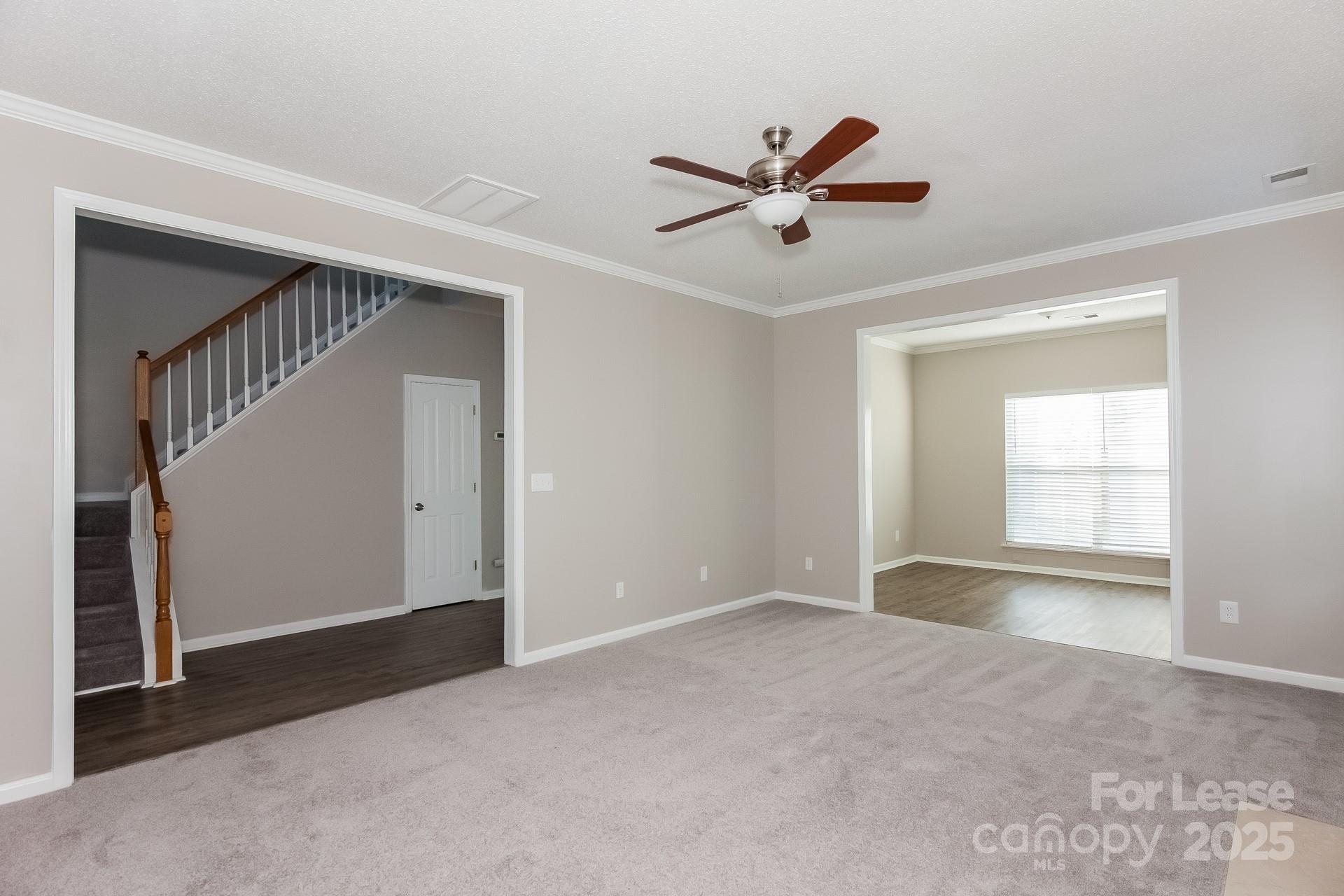 5537 Lemley Road Northwest Concord, NC 28027 - Photo 3 of 17 a view of an empty room with wooden floor and a window