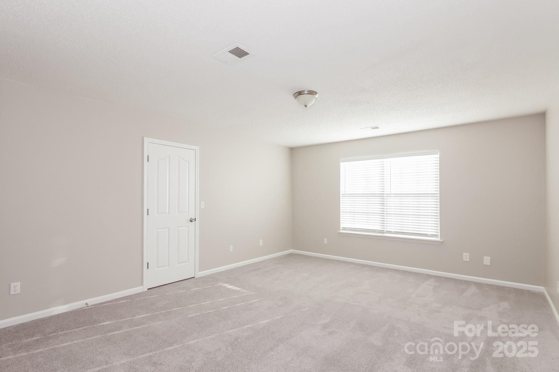 5537 Lemley Road Northwest Concord, NC 28027 - Photo 9 of 17 an empty room with a window