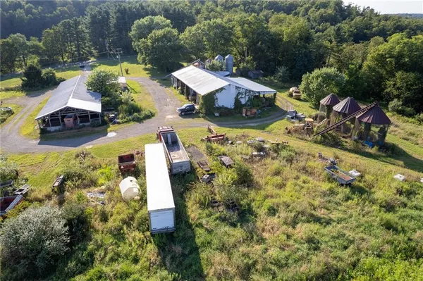 an aerial view of a house with garden space and street view