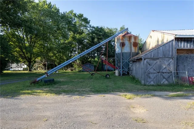 swimming pool view with a lake view