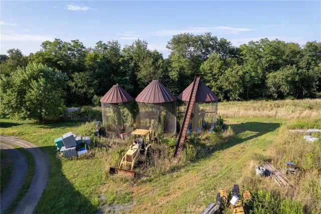 an aerial view of a house with a swimming pool