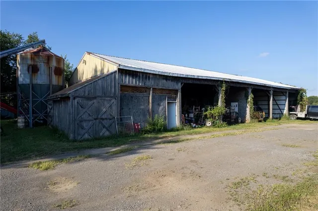 a view of a house with backyard and porch