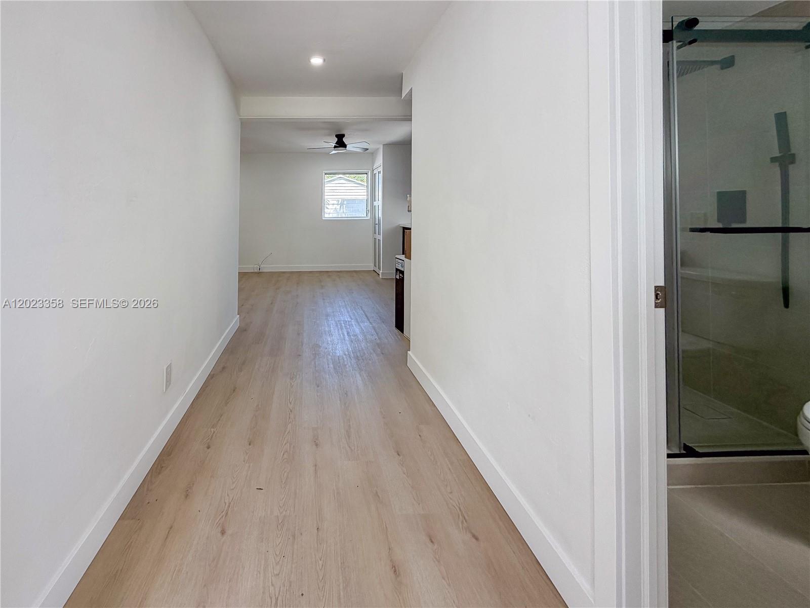 313 Southwest 1st Street, Unit 1 Hallandale Beach, FL 33009 - Photo 6 of 13 Entrance hallway with the bathroom on your right hand side.