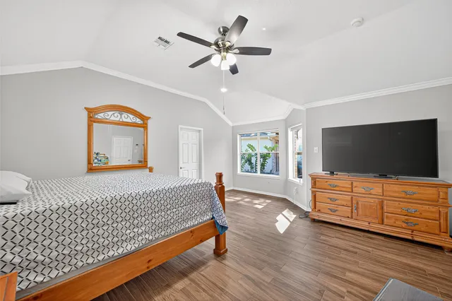 a bathroom with a double vanity sink a mirror and a bathtub