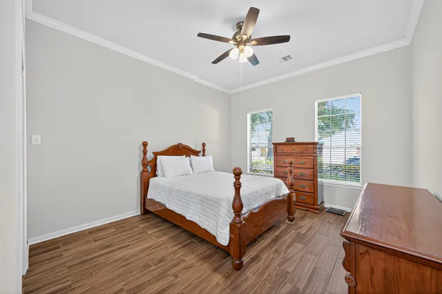 a bathroom with a sink double vanity and a toilet