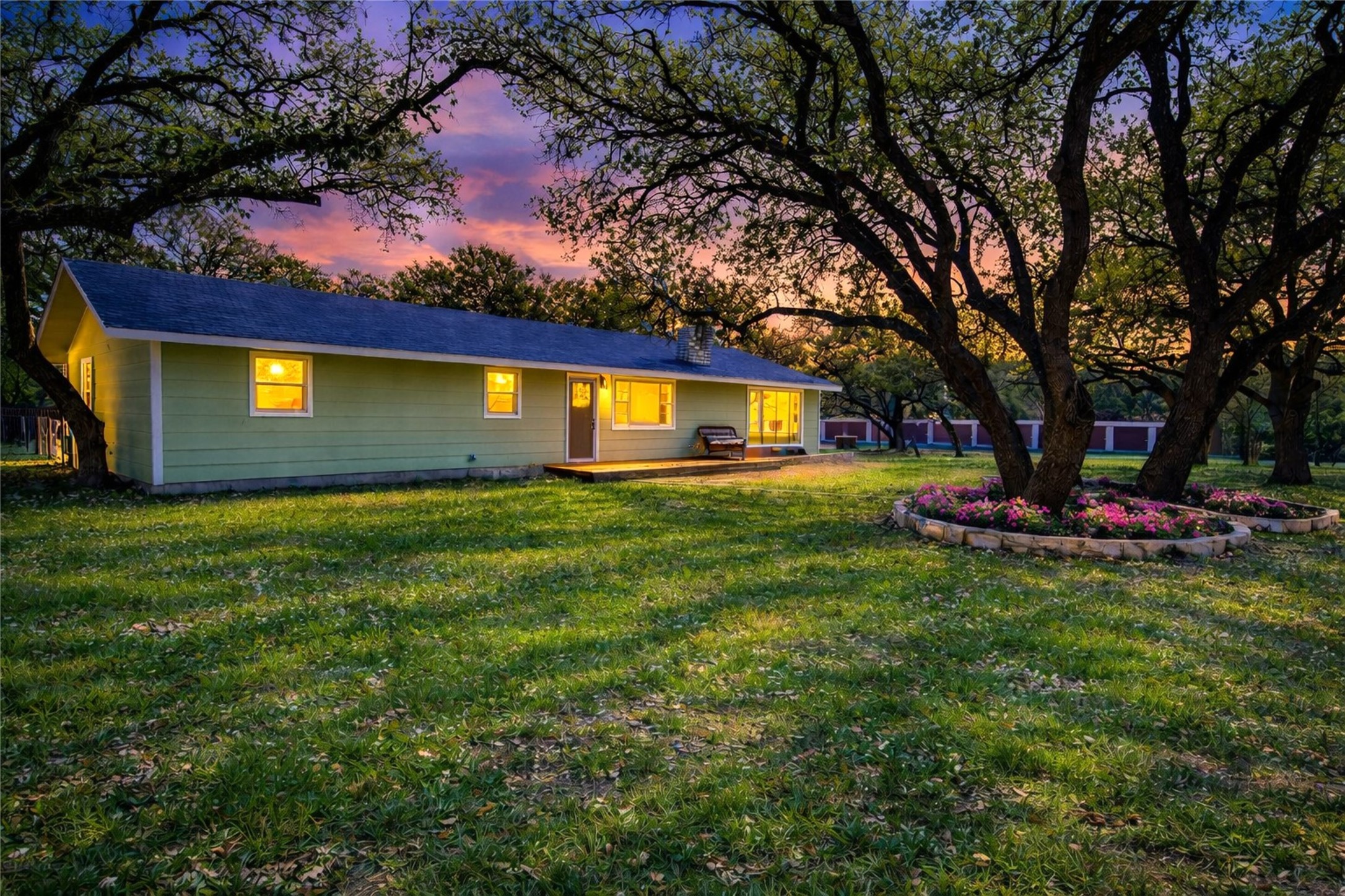 207 Haley Road Johnson City, TX 78636 - Photo 5 of 31 A tranquil rural retreat, this verdant yard with mature trees invites peaceful living.