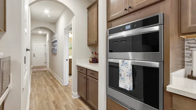 a bathroom with a shower sink and mirror