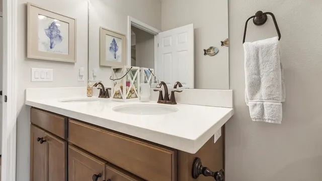 an aerial view of a house with table and chairs potted plants
