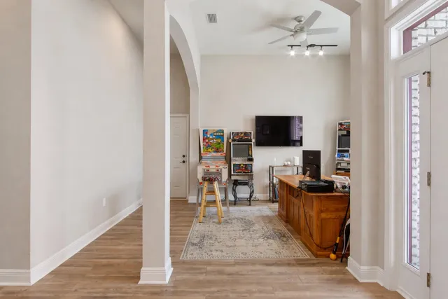 an aerial view of a house with a yard basket ball court and outdoor seating