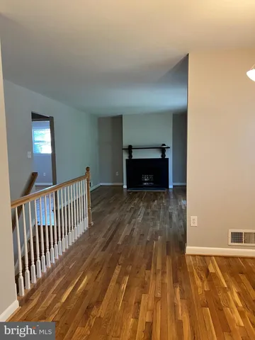a living room with a couch and a fireplace