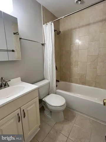 a bathroom with a sink a toilet and a bathtub