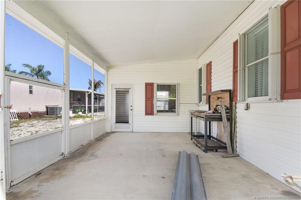 7149 Southeast Ridgeway Terrace Hobe Sound, FL 33455 - Photo 8 of 34 Screened patio